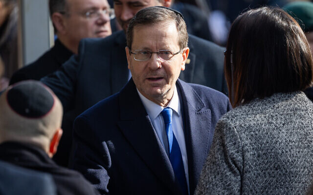 President Isaac Herzog attends the funeral of former Israeli parliament speaker Shevach Weiss at Mount Herzl Cemetery in Jerusalem on February 5, 2023. (Yonatan Sindel/Flash90) President Isaac Herzog attends the funeral of former Israeli parliament speaker Shevach Weiss at Mount Herzl Cemetery in Jerusalem on February 5, 2023. (Yonatan Sindel/Flash90)