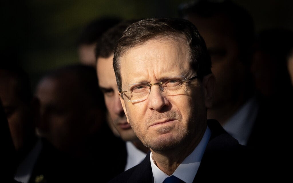 President Isaac Herzog at the funeral of former Knesset speaker Shevach Weiss on February 5, 2023. (Yonatan Sindel/Flash90) President Isaac Herzog at the funeral of former Knesset speaker Shevach Weiss on February 5, 2023. (Yonatan Sindel/Flash90)