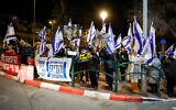 Israelis protest against the government's planned legal overhaul, in the West Bank settlement of Efrat, February 11, 2023. (Gershon Elinson /Flash90)