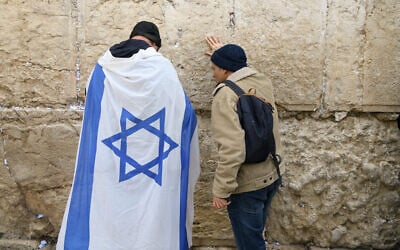 Protesters at the Western Wall in Jerusalem's Old City for a prayer session ahead of an anti-government demonstration, February 13, 2023 (Arie Leib Abrams/FLASH90)