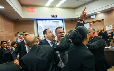 Lawmakers from the opposition are ejected from the Knesset Constitution, Law and Justice Committee meeting at the Knesset on February 13, 2023 (Yonatan Sindel/Flash90)