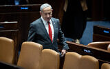 Prime Minister Benjamin Netanyahu arrives to a vote in the Knesset on February 15, 2023 (Yonatan Sindel/Flash90)