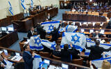 Opposition MKs holding Israeli flags during the discussion and vote on the government's judicial overhaul plans in the Knesset, February 20, 2023 (Photo by Yonatan Sindel/Flash90)