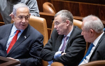 File - Prime Minister Benjamin Netanyahu (left), Justice Minister Yariv Levin (center) and Agriculture Minister Avi Dichter, in the Knesset on February 22, 2023. (Yonatan Sindel/Flash90)