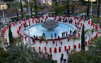 Israelis dressed as characters from 'The Handmaid's Tale' protest the government's planned judicial overhaul, in Tel Aviv, February 25, 2023. (Tomer Neuberg/Flash90)