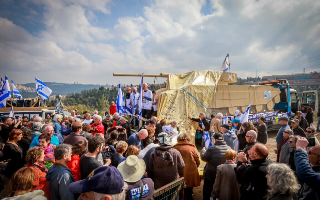 Veterans of the Yom Kippur War and others protest against the government's judicial overhaul plans, in Mevaseret Zion, near Jerusalem, February 25, 2023. (Yossi Zamir/Flash90) Veterans of the Yom Kippur War and others protest against the government's judicial overhaul plans, in Mevaseret Zion, near Jerusalem, February 25, 2023. (Yossi Zamir/Flash90)