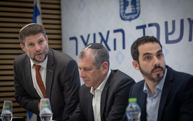 Finance Minister Bezalel Smotrich (left) presents the state budget at the Finance Ministry, in Jerusalem, on February 28, 2023. (Yonatan Sindel/Flash90) Finance Minister Bezalel Smotrich (left) presents the state budget at the Finance Ministry, in Jerusalem, on February 28, 2023. (Yonatan Sindel/Flash90)