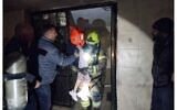 Firefighters evacuate residents from a building on fire in Beersheba on February 8, 2023. (Fire and Rescue Service)