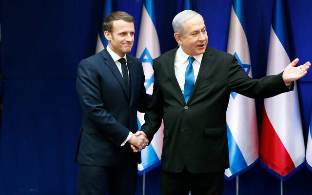 File - Israeli Prime Minister Benjamin Netanyahu shakes hands with French President Emmanuel Macron during their meeting in Jerusalem, January 22, 2020. (Ronen Zvulun/Pool Photo via AP) File - Israeli Prime Minister Benjamin Netanyahu shakes hands with French President Emmanuel Macron during their meeting in Jerusalem, January 22, 2020. (Ronen Zvulun/Pool Photo via AP)