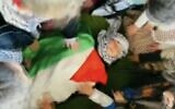 Screen capture from a video published by the Al-Tofula Kindergarten in Beit Awwa in the West Bank, showing children simulating a 'martyr' funeral for one of their number who is killed in a pretend clash with the IDF, February 14, 2023. (Twitter. Used in accordance with Clause 27a of the Copyright Law)