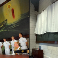 A before and after photo depicting how a painting of Jesus at the U.S. Merchant Marine Academy in Kings Point, New York, had been obscured by a curtain. (Before: U.S. Coast Guard; After: U.S. Merchant Marine Academy.)