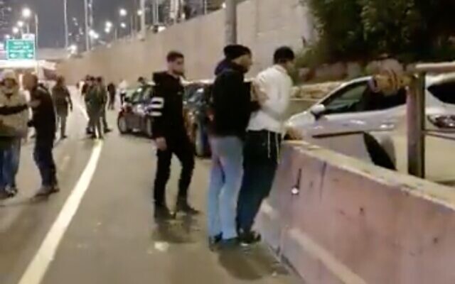 A driver suspected of dangerously veering toward anti-government protesters is arrested by police in Tel Aviv, February 25, 2023. (Screenshot/Twitter; used in accordance with Clause 27a of the Copyright Law) A driver suspected of dangerously veering toward anti-government protesters is arrested by police in Tel Aviv, February 25, 2023. (Screenshot/Twitter; used in accordance with Clause 27a of the Copyright Law)