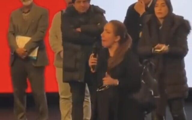 A screenshot from a video shared on social media on February 17, 2023, shows an Iranian woman who threw her headscarf to the ground in a sign of protest, during an engineering in Tehran, Iran. (Twitter video screenshot; used in accordance with Clause 27a of the Copyright Law) A screenshot from a video shared on social media on February 17, 2023, shows an Iranian woman who threw her headscarf to the ground in a sign of protest, during an engineering in Tehran, Iran. (Twitter video screenshot; used in accordance with Clause 27a of the Copyright Law)