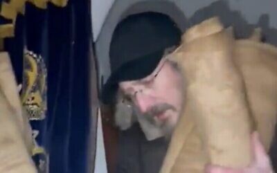 Screen capture from video of Torah scrolls being removed from the earthquake-damaged synagogue in Antakya, Turkey, February 7, 2023 (Twitter. Used in accordance with Clause 27a of the Copyright Law)