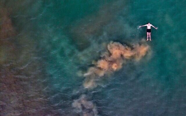 A man floats on the Dead Sea, on January 23, 2023. (Roni Ofer/Flash90)