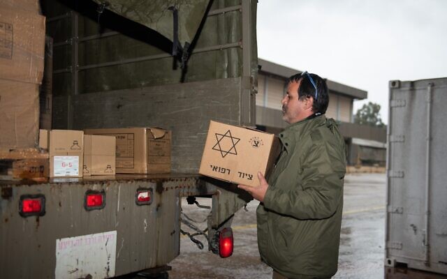 An IDF soldier prepares a shipment of aid and equipment for the search and rescue team departing to assist Turkey in the wake of a deadly earthquake on February 6, 2023. (Israel Defense Forces) An IDF soldier prepares a shipment of aid and equipment for the search and rescue team departing to assist Turkey in the wake of a deadly earthquake on February 6, 2023. (Israel Defense Forces)