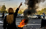 Iranians protest the death of 22-year-old Mahsa Amini after she was detained by the morality police, in Tehran, October 1, 2022. (AP Photo/Middle East Images)