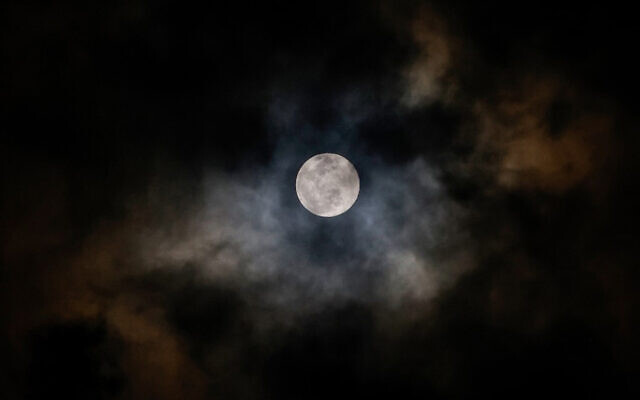 The full moon apears from behind the clouds in Tulum, Mexico, February 4, 2023. (David Gannon/AFP) The full moon apears from behind the clouds in Tulum, Mexico, February 4, 2023. (David Gannon/AFP)
