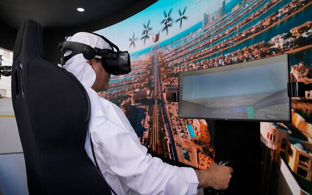 A man experiences a driving simulator of a flying taxi at the Dubai Roads and Transportation Authority's stand during the World Government SummitWLD in Dubai, United Arab Emirates, Monday, Feb 13, 2023. (AP Photo/Kamran Jebreili) A man experiences a driving simulator of a flying taxi at the Dubai Roads and Transportation Authority's stand during the World Government SummitWLD in Dubai, United Arab Emirates, Monday, Feb 13, 2023. (AP Photo/Kamran Jebreili)