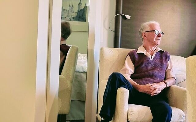 Holocaust survivor and TikTok influencer Gidon Lev in his hotel room in Prague, January 2023. (Courtesy)