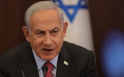 Prime Minister Benjamin Netanyahu leads the weekly cabinet meeting at his office in Jerusalem, on March 19, 2023. (Abir Sultan/Pool/AFP)