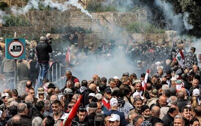 Illustrative: Tear gas is fired during a demonstration by retired Lebanese army and security forces veterans, demanding inflation-adjustments to their pensions, outside the government palace headquarters in the center of Beirut on March 22, 2023. (ANWAR AMRO/AFP)