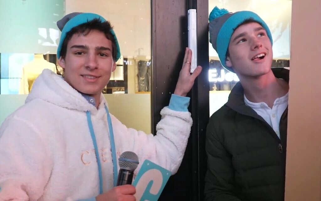 Attendees of a Chabad teen convention in Times Square pose next to the mezuzah affixed to the doorpost of American Eagle Outfitters' flagship store. (Courtesy of Chabad via JTA) Attendees of a Chabad teen convention in Times Square pose next to the mezuzah affixed to the doorpost of American Eagle Outfitters' flagship store. (Courtesy of Chabad via JTA)