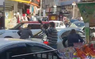 Armed men, said to be undercover Israeli forces, are seen operating in the West Bank city of Jenin, March 16, 2023. (Screenshot: Twitter)