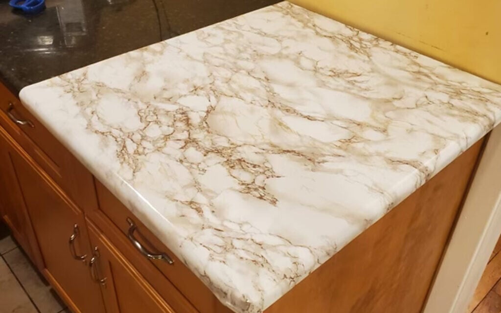 Kosher Dekal is coming back with a new design and formula for its countertop linings, which caused a scandal last year after customers had trouble taking them off their counters. (Courtesy via JTA)