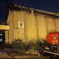 This image obtained from the Iranian news agency IRNA on October 16, 2022, shows a fire truck in front of Evin Prison, in the northwest of the Iranian capital Tehran. (AFP)