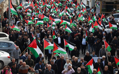 Protesters wave Palestinian flags during a demonstration marking the annual Land Day in the northern Arab-Israeli town of Sakhnin on March 30, 2023 (AHMAD GHARABLI / AFP) Protesters wave Palestinian flags during a demonstration marking the annual Land Day in the northern Arab-Israeli town of Sakhnin on March 30, 2023 (AHMAD GHARABLI / AFP)