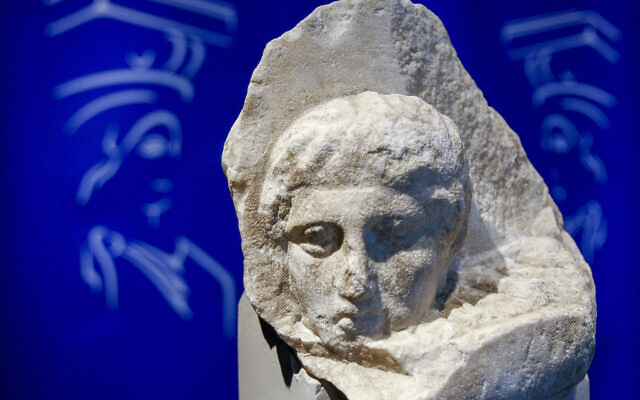 The marble head of a young man, a tiny fragment from the 2,500-year-old sculptured decoration of the Parthenon Temple on the ancient Acropolis, is displayed during a presentation to the press at the new Acropolis Museum in Athens, November 5, 2008. (Thanassis Stavrakis/AP) The marble head of a young man, a tiny fragment from the 2,500-year-old sculptured decoration of the Parthenon Temple on the ancient Acropolis, is displayed during a presentation to the press at the new Acropolis Museum in Athens, November 5, 2008. (Thanassis Stavrakis/AP)