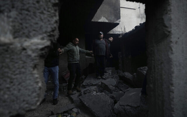 Palestinians inspect the site of a damaged building following an Israeli forces raid in the West Bank city of Jenin, Tuesday, March 7, 2023. (AP Photo/Majdi Mohammed) Palestinians inspect the site of a damaged building following an Israeli forces raid in the West Bank city of Jenin, Tuesday, March 7, 2023. (AP Photo/Majdi Mohammed)