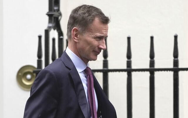 Britain's Chancellor of the Exchequer Jeremy Hunt leaves Downing Street in London, March 8, 2023. (AP Photo/Kin Cheung) Britain's Chancellor of the Exchequer Jeremy Hunt leaves Downing Street in London, March 8, 2023. (AP Photo/Kin Cheung)