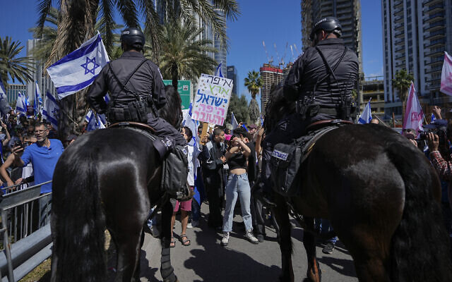 Mounted police are deployed as Israelis block a main road to protest against plans by Prime Minister Benjamin Netanyahu's new government to overhaul the judicial system, in Tel Aviv, Israel, March 9, 2023. (AP Photo/Ohad Zwigenberg) Mounted police are deployed as Israelis block a main road to protest against plans by Prime Minister Benjamin Netanyahu's new government to overhaul the judicial system, in Tel Aviv, Israel, March 9, 2023. (AP Photo/Ohad Zwigenberg)
