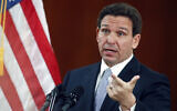 Florida Governor Ron DeSantis answers questions from reporters after his State of the State address during a joint session of the Senate and House of Representatives March 7, 2023, at the Capitol in Tallahassee, Florida. (AP Photo/Phil Sears)