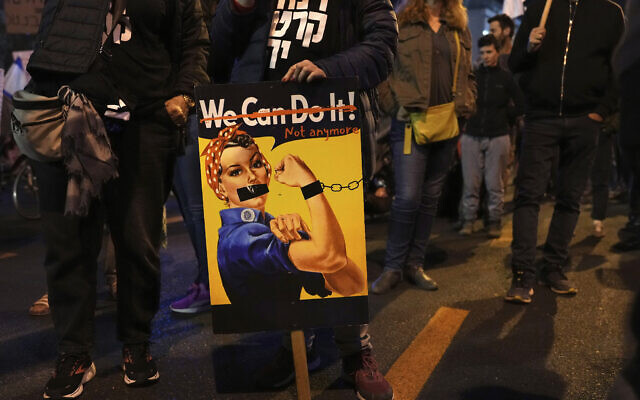 Demonstrators attend a protest in Tel Aviv against the government's controversial judicial overhaul legislation, March 11, 2023. (AP Photo/Tsafrir Abayov) Demonstrators attend a protest in Tel Aviv against the government's controversial judicial overhaul legislation, March 11, 2023. (AP Photo/Tsafrir Abayov)