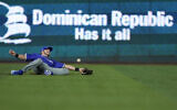 Israel left fielder Spencer Horowitz is unable to catch a ball hit by Dominican Republic's Juan Soto for a double during the first inning of a World Baseball Classic game, Tuesday, March 14, 2023, in Miami. (AP/Wilfredo Lee)
