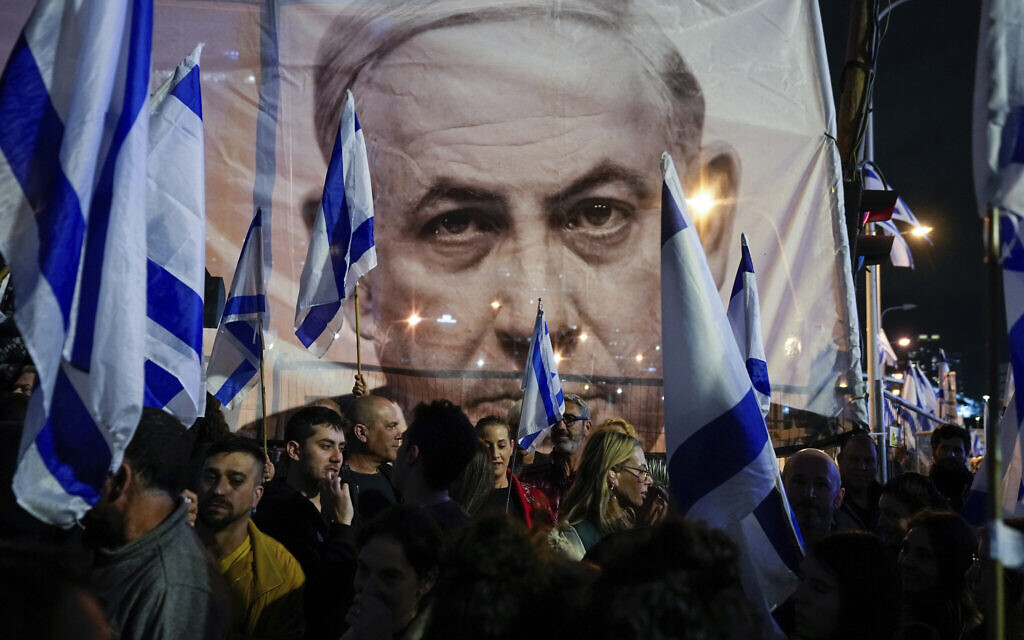Israelis protest against plans by Prime Minister Benjamin Netanyahu's government to overhaul the judicial system, in Tel Aviv, March 18, 2023. (AP/Ohad Zwigenberg) Israelis protest against plans by Prime Minister Benjamin Netanyahu's government to overhaul the judicial system, in Tel Aviv, March 18, 2023. (AP/Ohad Zwigenberg)