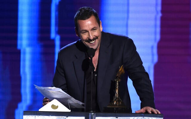 File: Adam Sandler accepts the award for best male lead for "Uncut Gems" at the 35th Film Independent Spirit Awards in Santa Monica, California, February 8, 2020. (AP/Chris Pizzello) File: Adam Sandler accepts the award for best male lead for "Uncut Gems" at the 35th Film Independent Spirit Awards in Santa Monica, California, February 8, 2020. (AP/Chris Pizzello)