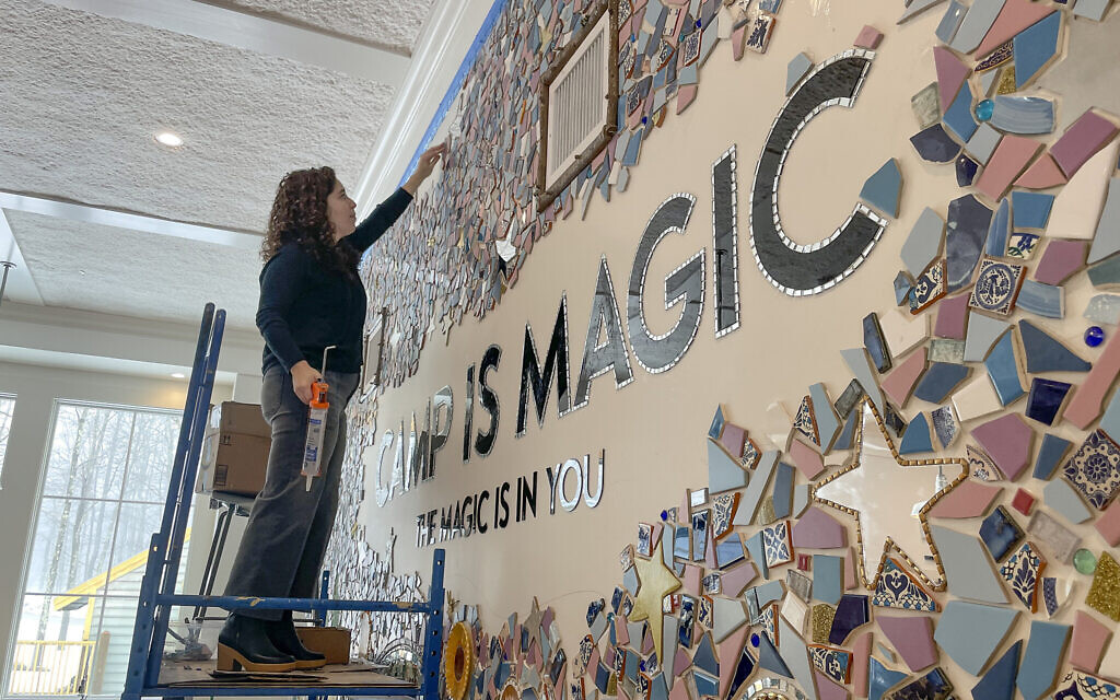 Artist Mia Schon finishes a mural in one of the activity rooms of the Hole In the Wall Gang Camp, March 2, 2023, in Ashford, Connecticut. (AP Photo/Pat Eaton Robb) Artist Mia Schon finishes a mural in one of the activity rooms of the Hole In the Wall Gang Camp, March 2, 2023, in Ashford, Connecticut. (AP Photo/Pat Eaton Robb)