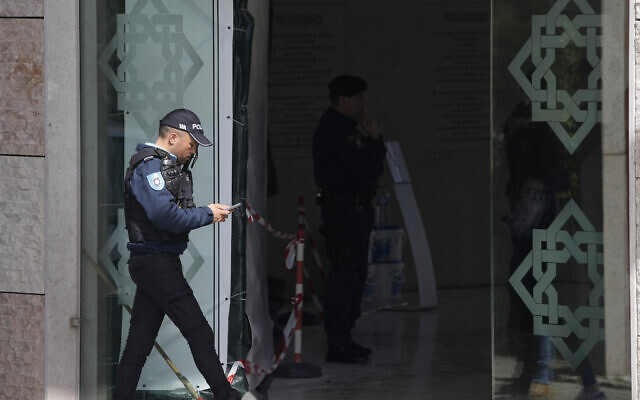 A police officer walks at the entrance of an Ismaili Muslim center in Lisbon, Portugal, Tuesday, March 28, 2023. (AP/Armando Franca) A police officer walks at the entrance of an Ismaili Muslim center in Lisbon, Portugal, Tuesday, March 28, 2023. (AP/Armando Franca)