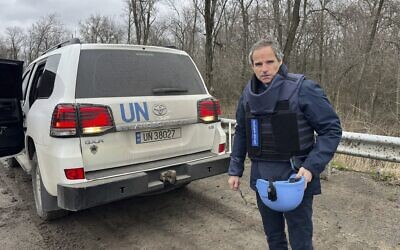 In this photo provided by the IAEA Press Office, UN atomic energy chief Rafael Mariano Grossi stands on a road next to a UN vehicle on his way to the Zaporizhzhia Nuclear Power Plant, in southeastern Ukraine, March 29, 2023. (IAEA Press Office via AP) In this photo provided by the IAEA Press Office, UN atomic energy chief Rafael Mariano Grossi stands on a road next to a UN vehicle on his way to the Zaporizhzhia Nuclear Power Plant, in southeastern Ukraine, March 29, 2023. (IAEA Press Office via AP)