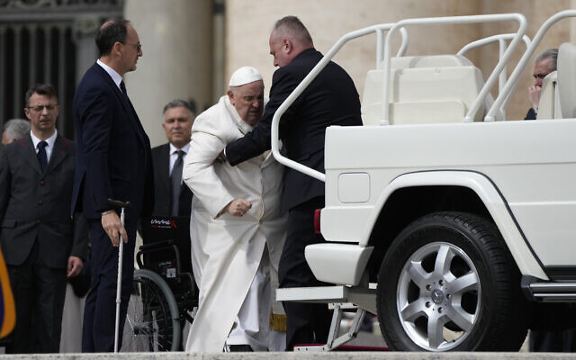 Pope Francis helped to get on his car at the end of weekly general audience in St. Peter's Square, at the Vatican, March 29, 2023. (AP Photo/Alessandra Tarantino) Pope Francis helped to get on his car at the end of weekly general audience in St. Peter's Square, at the Vatican, March 29, 2023. (AP Photo/Alessandra Tarantino)