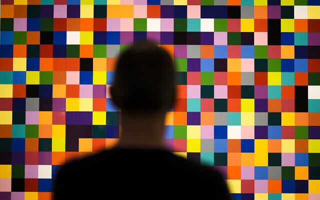 A man looks to a painting '4900 Colours (excerpt)' in a new exhibition with art works of German artist Gerhard Richter at the New National Gallery in Berlin, Germany, Friday, March 31, 2023. (AP Photo/Markus Schreiber) A man looks to a painting '4900 Colours (excerpt)' in a new exhibition with art works of German artist Gerhard Richter at the New National Gallery in Berlin, Germany, Friday, March 31, 2023. (AP Photo/Markus Schreiber)