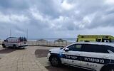Police and Magen David Adom paramedics at the scene where the body of a man was found on a beachin Ashdod, March 15, 2023. (Magen David Adom)
