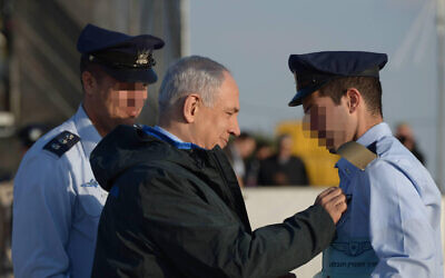 FILE: Prime Minister Benjamin Netanyahu attends the graduation ceremony of new Israeli Air Force pilots at the Hatzerim Air Force base, December 31, 2015 (Photo by Amos Ben Gershom/GPO)