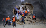 Construction workers in a tunnel being bored for a new highway into Jerusalem on March 25, 2021. (Yonatan Sindel/FLASH90)
