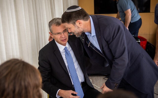 Likud's Yariv Levin (L) and far-right Religious Zionism party leader Bezalel Smotrich at a conference outside the Supreme Court in Jerusalem, on October 30, 2022. (Yonatan Sindel/Flash90) Likud's Yariv Levin (L) and far-right Religious Zionism party leader Bezalel Smotrich at a conference outside the Supreme Court in Jerusalem, on October 30, 2022. (Yonatan Sindel/Flash90)