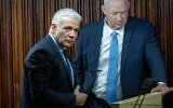 Yesh Atid head MK Yair Lapid (left) and National Unity head MK Benny Gantz in the Knesset in Jerusalem, February 20, 2023. (Yonatan Sindel/Flash90)